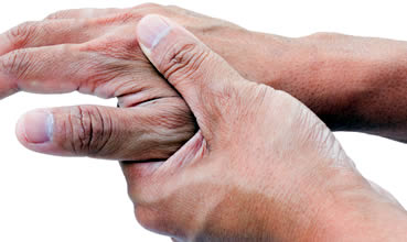 Arthritis sufferer rubbing hands